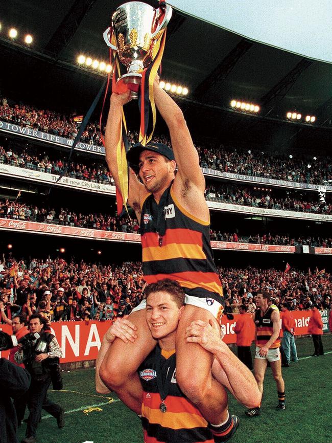 Mark Bickley and Andrew McLeod with the 1998 premiership cup.