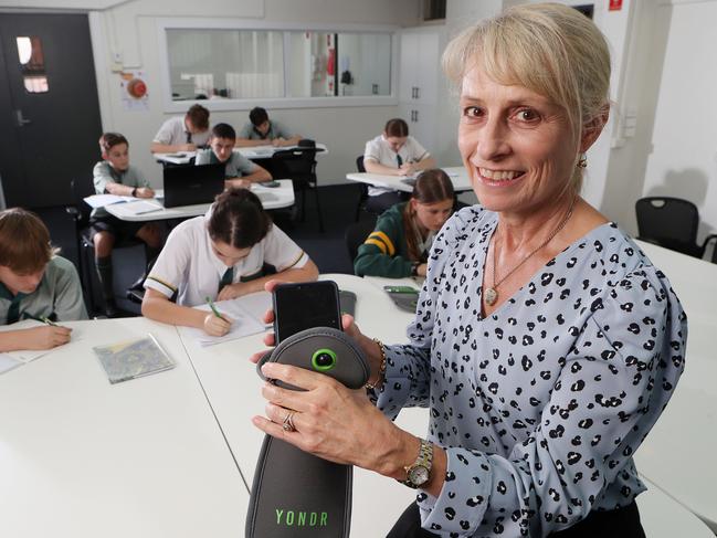 Principal Helen Jamieson with the YONDR phone locking pouch, Corinda State High School. Picture: Liam Kidston