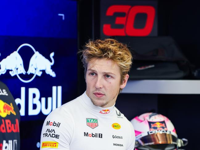 BAHRAIN, BAHRAIN - FEBRUARY 26: Liam Lawson of New Zealand and Oracle Red Bull Racing looks on in the garage during day one of F1 Testing at Bahrain International Circuit on February 26, 2025 in Bahrain, Bahrain. (Photo by Mark Thompson/Getty Images)