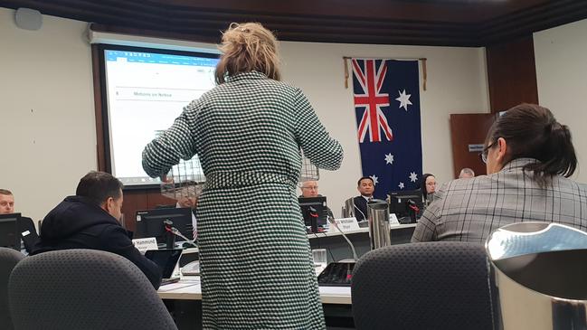 Councillor Therese Bonomi holds a cat trap as she implores her colleagues not to introduce a bylaw targeting felines. Picture: Colin James