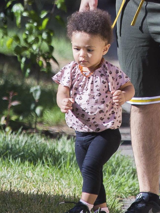Serena Williams and her husband Alexis Ohanian enjoy an afternoon walk with their 1-year-old daughter Alexia Olympia. Serena's daughter looked seriously cute, toddling her way down the footpath, wearing Nike sneakers like her Mummy. Picture: MediaMode
