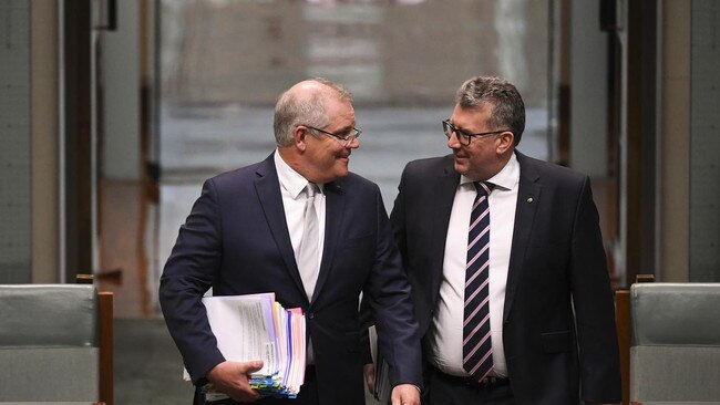 Scott Morrison and Keith Pitt enter the House of Representatives. Mr Pitt has apologised to the welfare recipients unfairly targeted by robodebt.