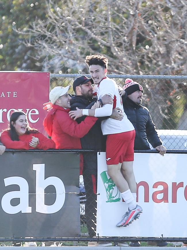 Domenic Costanzo celebrates scoring the winner for Croydon against Modbury. Picture: Adam Butler