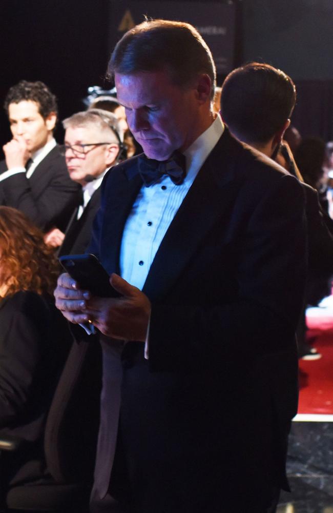 This previously unseen image of PwC accountant Brian Cullinan tweeting backstage ... a move that led to the Best Picture debacle. Picture: Splash