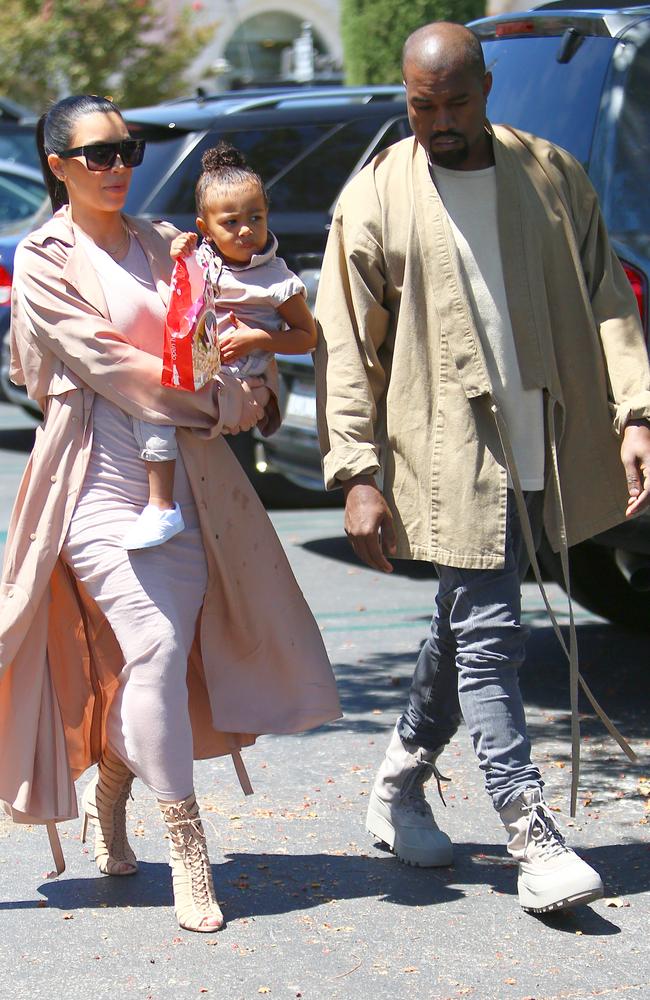 Kim Kardashian, Kanye West and their two-year-old daughter North, out in Calabasas.