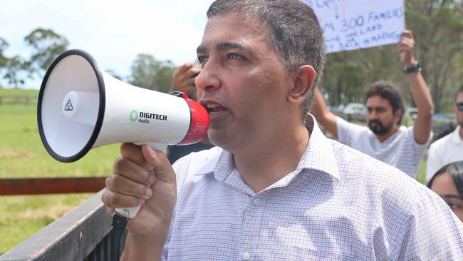 Nazim Chaudhry leads fellow Qartaba customers at a rally outside the home of Wajahat Rana in February. Picture: Alexi Demetriadi