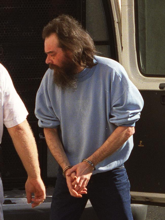 Mark Ray Haydon arrives at Adelaide Magistrates Court in handcuffs in 1999. Picture: Martin Jacka/File