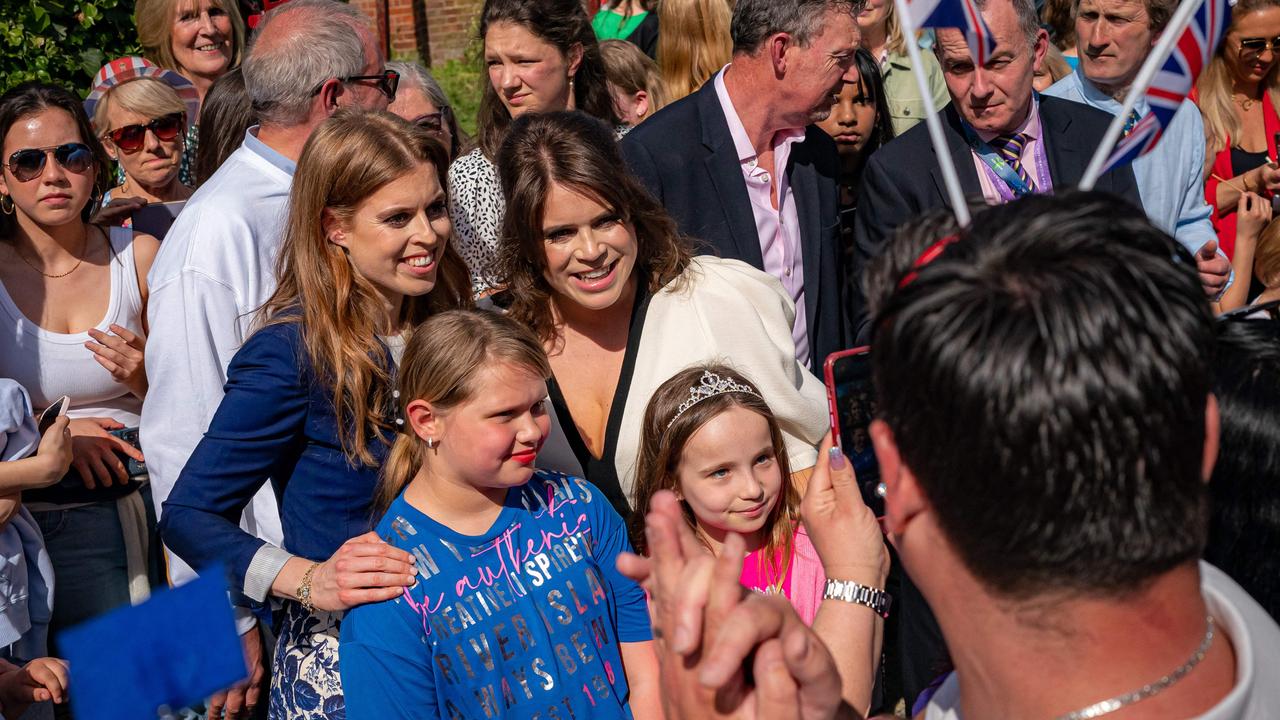 Britain's Princess Eugenie of York (C) and Britain's Princess Beatrice of York (centre left). Picture: AFP