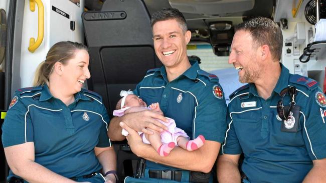 TEAM: Gatton Ambulance Station's newest paramedics Brooke Milford, Tim Smolders (with baby Sasha) and Marcus Clemenkowff. Picture: Lachlan McIvor