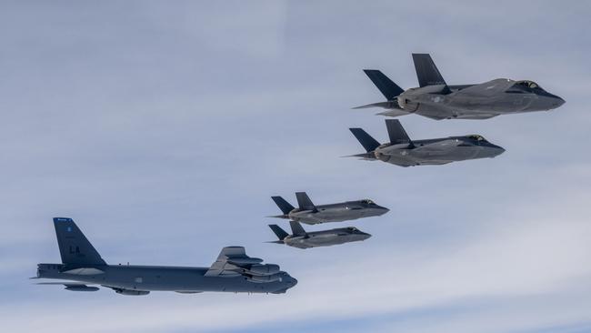 A US B-52H bomber and South Korean F-35A fighters stage a joint air drill on Friday. Picture: Getty Images