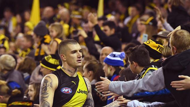 Dustin Martin celebrates Richmond’s round 11, 2017 win with fans.