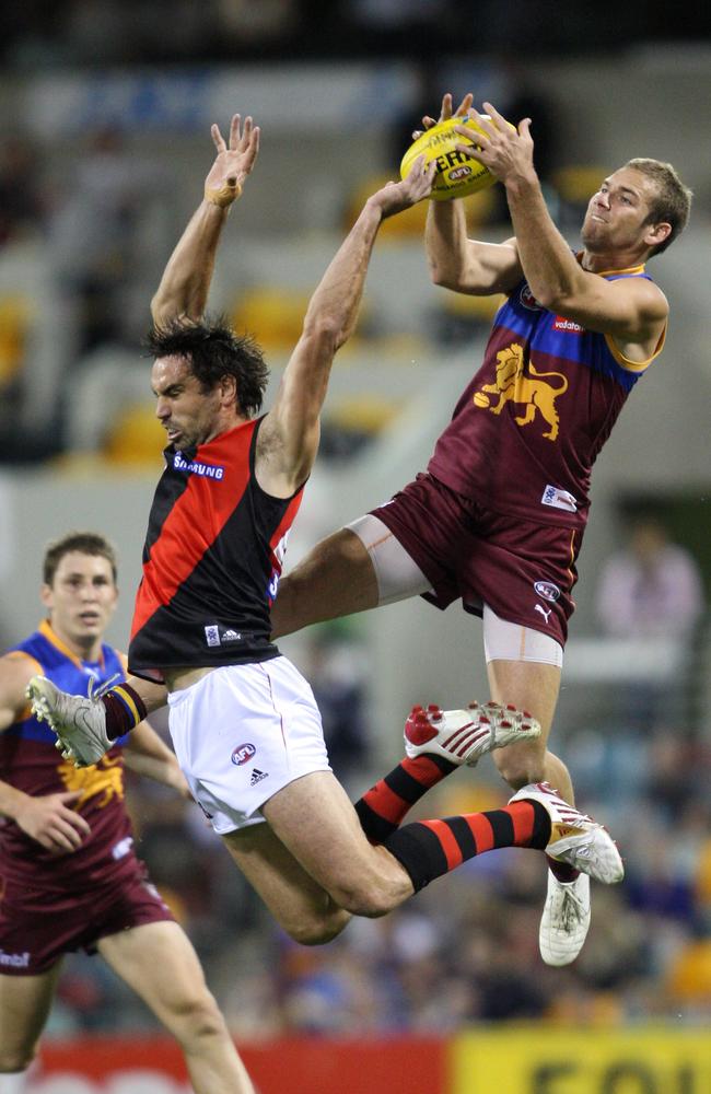 Jared Brennan marks over the top of Scott Lucas in 2009.