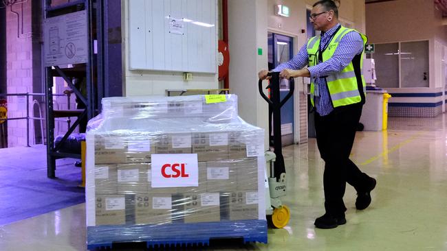 A workers at CSL rolls out a batch of the AstraZeneca vaccine in Melbourne. Picture: Getty