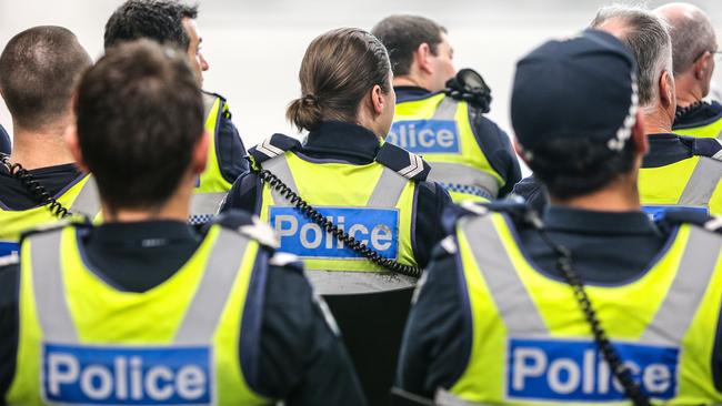 Members of the Operations Response Unit get a briefing. Picture: Ian Currie