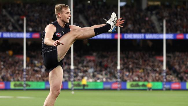 Will Hayes kicks for goal against Geelong at the MCG. Photo by Michael Klein