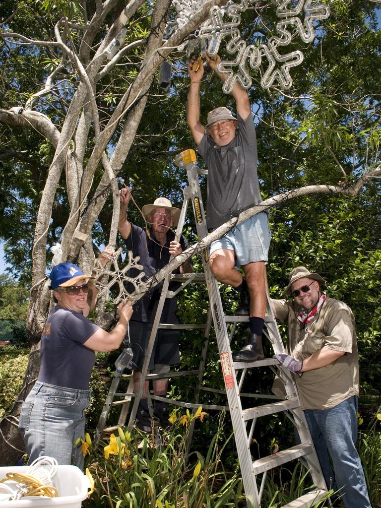 Lions Club of West Toowoomba members and volunteers including (from left) Lesley Henry, Rod Hultgren, Leo Dittman and Johan Human get Queens Park ready for Toowoomba's Christmas Wonderland, Monday, November 25, 2013. Photo Kevin Farmer / The Chronicle