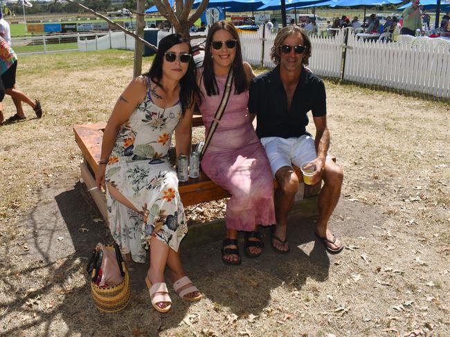 Suzie Harnden, Ashlee Hilliar and Shane Peters having an action-packed day at the Ladbrokes Stony Creek Cup on Sunday, March 09, 2025. Picture: Jack Colantuono