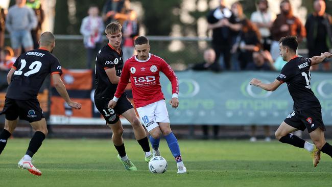 Melbourne Knights’ Jack Morton surrounded by Brisbane Roar defenders.