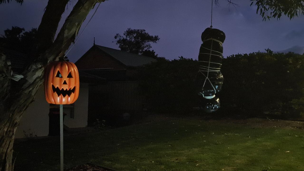 The scene, which Mr Abbie says he will make small changes to, shows several ghosts standing around a fire as a body bag hangs from a tree nearby. Pictures: Facebook