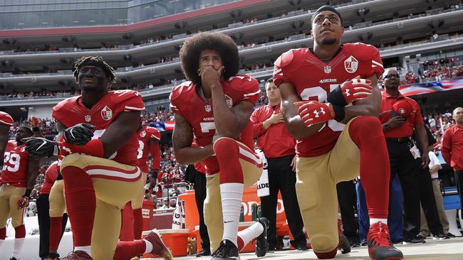 49ers Eli Harold, left, Colin Kaepernick, centre, and Eric Reid. (AP Photo/Marcio Jose Sanchez, File)