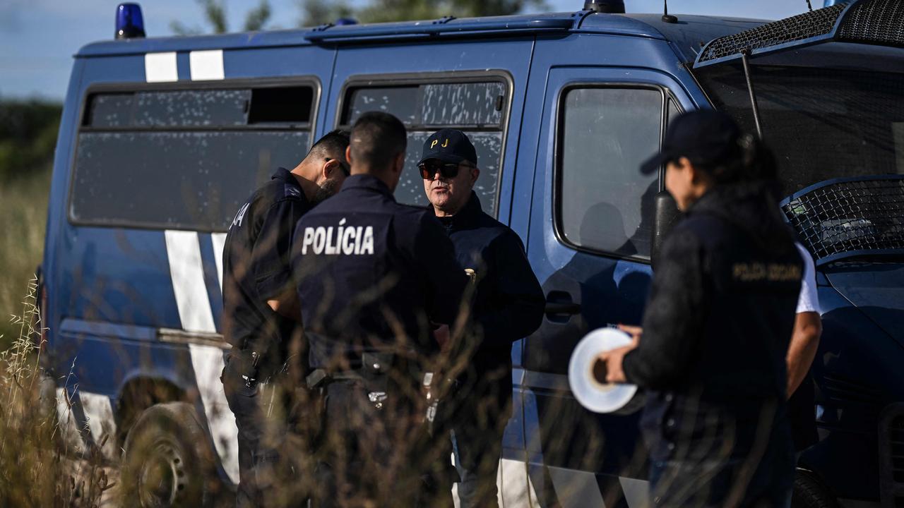 Portuguese Criminal Investigation Police (PJ) investigators stand in a road for new search operations. Picture: Patricia De Melo Moreira / AFP