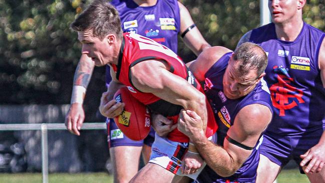 Matthew Burkett is tackled by Matthew Krul. Picture: Aaron Cook