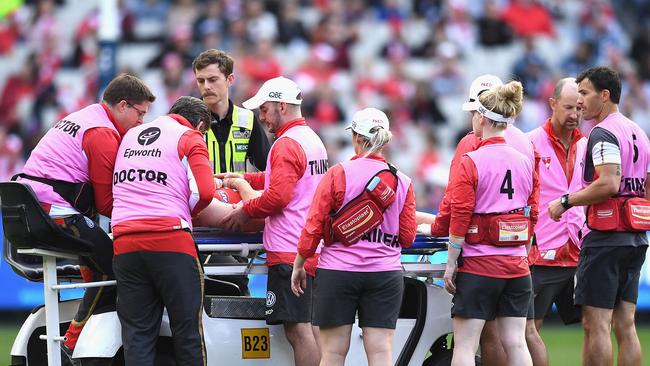 Medicos and trainers attend to Rohan. Picture: Getty Images