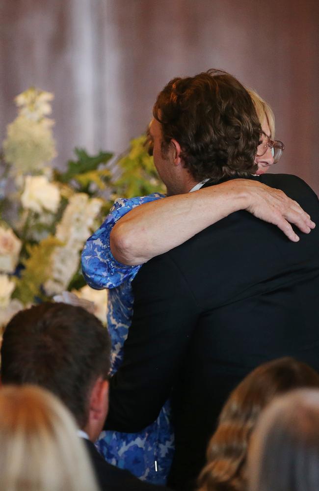 Sue Mackey gets a hug from son Rowan. Picture: Alan Barber