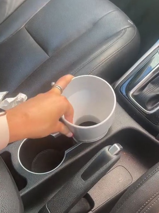 She used an $11.05 PVC pipe to create a larger cup holder in her car. Picture: TikTok/maddyryan44