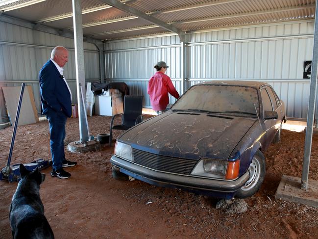 Damian Loone and Rachelle Childs’ sister Kristy talk about the case while looking at Rachelle's Commodore. Picture: Jeff Darmanin