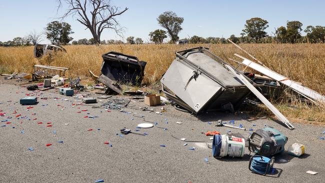 Wreckage from the crash is strewn across the road. Picture: Ian Currie