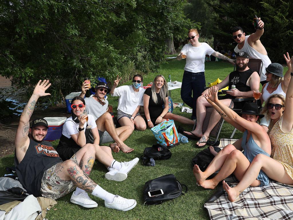 People gather in Footscray Park opposite Flemington Racecourse.