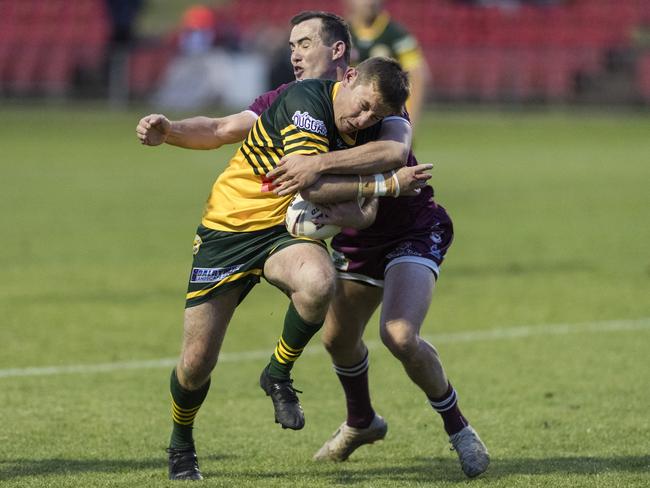 Wattles player Michael Duggan tackled by Harrison Skinner of Dalby. Picture: Kevin Farmer.