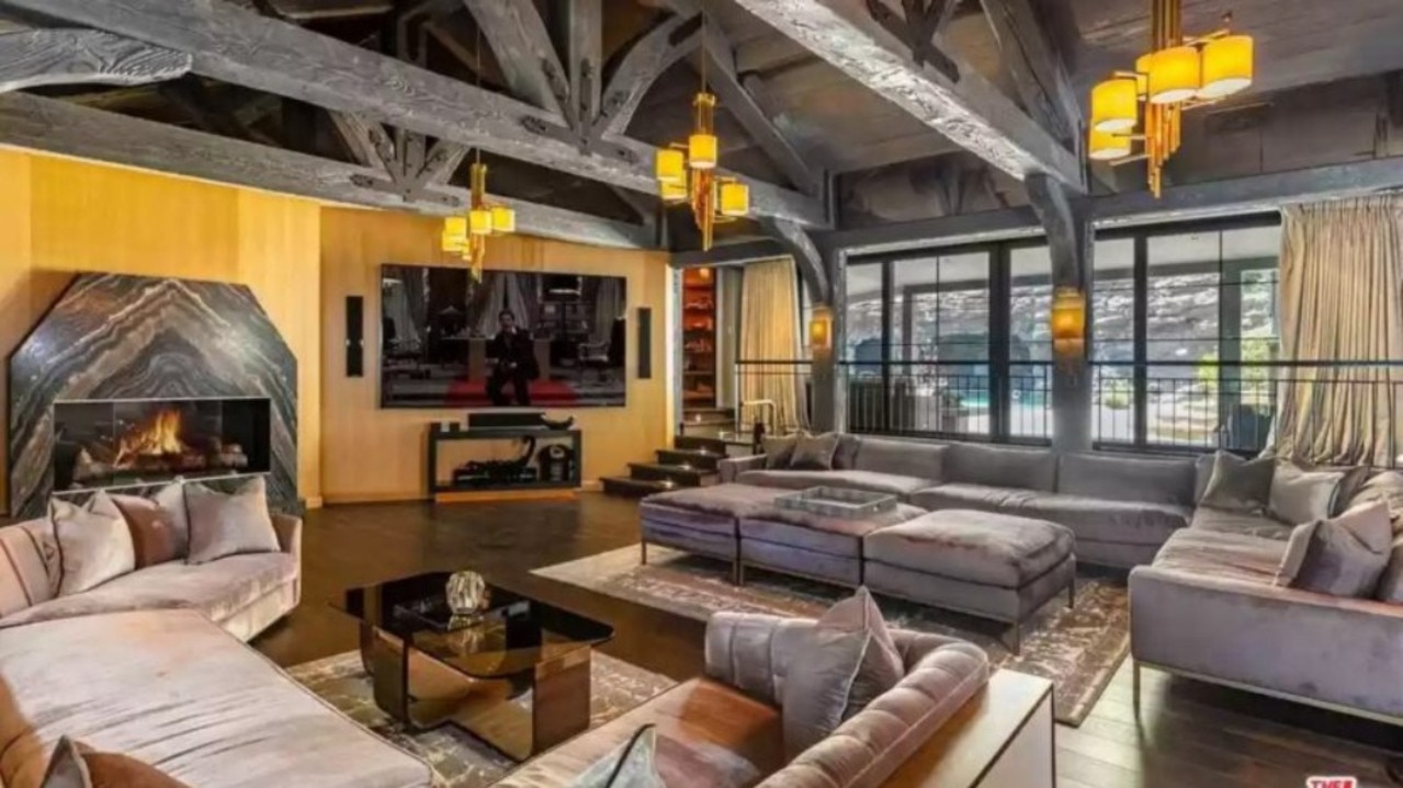 The huge living area and fireplace in the Tudor-style home. Picture: Realtor.com