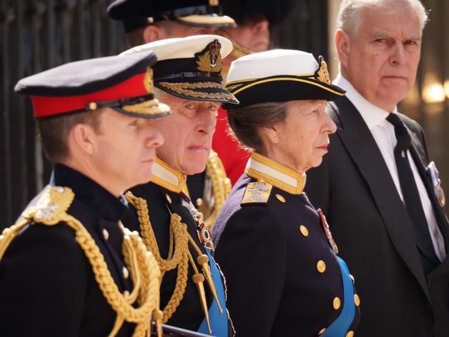 LONDON, ENGLAND - SEPTEMBER 19: King Charles III, Anne, Princess Royal and Prince Andrew, Duke of York watch on as The Queen's funeral cortege borne on the State Gun Carriage of the Royal Navy as it departs Westminster Abbey on September 19, 2022 in London, England. Elizabeth Alexandra Mary Windsor was born in Bruton Street, Mayfair, London on 21 April 1926. She married Prince Philip in 1947 and ascended the throne of the United Kingdom and Commonwealth on 6 February 1952 after the death of her Father, King George VI. Queen Elizabeth II died at Balmoral Castle in Scotland on September 8, 2022, and is succeeded by her eldest son, King Charles III. (Photo by Christopher Furlong/Getty Images)