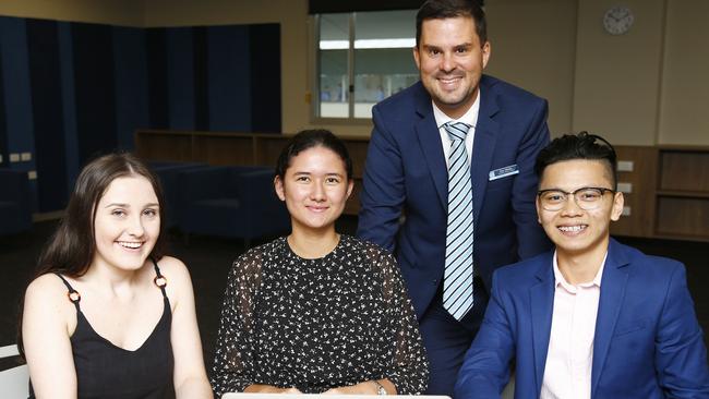 Jasmine Richards, Sophia Mepham and Zung Dang with Senior School Principal Ben Weeks at Southport State School. Picture: Tertius Pickard