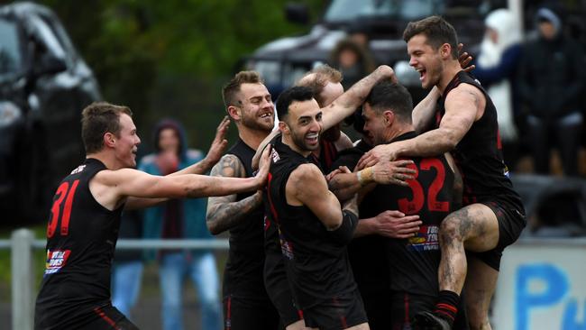 Hampton Park players are elated after winning last year’s grand final.