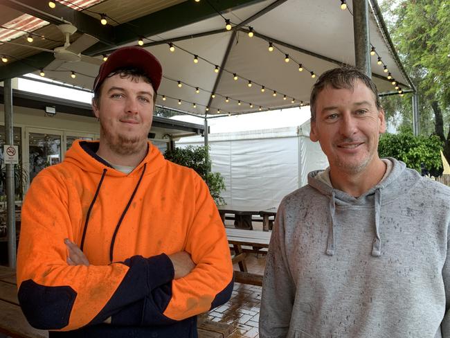 Brandon Statham and Damien Lindsay in Coramba during the floods.