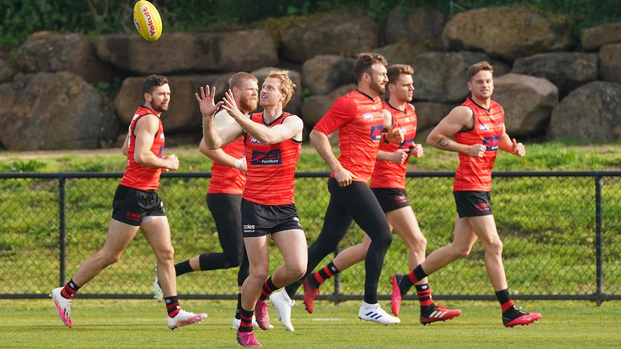 Conor McKenna, Michael Hurley, Cale Hooker, Matt Guelfi and teammates train during an AFL Essendon Bombers training session in Melbourne, Wednesday, June 17, 2020. Picture: AAP