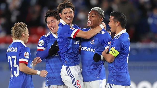 Yokohama F. Marinos forward Onaiwu Ado (2nd R) celebrates a goal with teammates. Picture: AFP