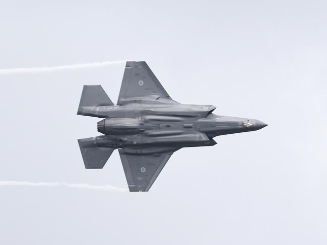 The Royal Australian Air Force has flown a Lockheed Martin F-35 Lightning II strike fighter jet to Cairns, the first time one of the air force's fifth generation fighter jets has visited Far North Queensland. Wing Commander Phil Eldridge executes a low pass flyover with the F-35 Lightning II over the Cairns Esplanade. Picture: Brendan Radke