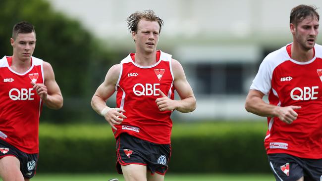 Callum Mills, centre, is still too important for the Swans across half-back for a midfield move to happen.