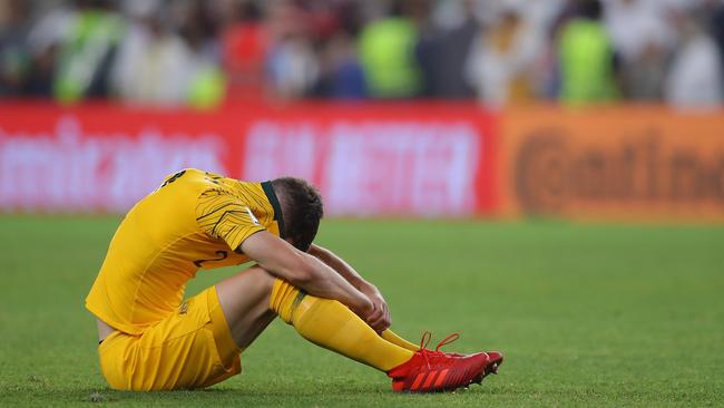 Milos Degenek of Australia looks dejected after the match. Picture: Francois Nel/Getty Images