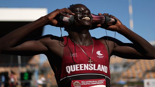 BRISBANE, AUSTRALIA - DECEMBER 06: Gout Gout of Queensland celebrates winning the Boys' U18 100m final during the 2024 Chemist Warehouse Australian All Schools Athletics Championship at Queensland Sport and Athletics Centre on December 06, 2024 in Brisbane, Australia. (Photo by Cameron Spencer/Getty Images)