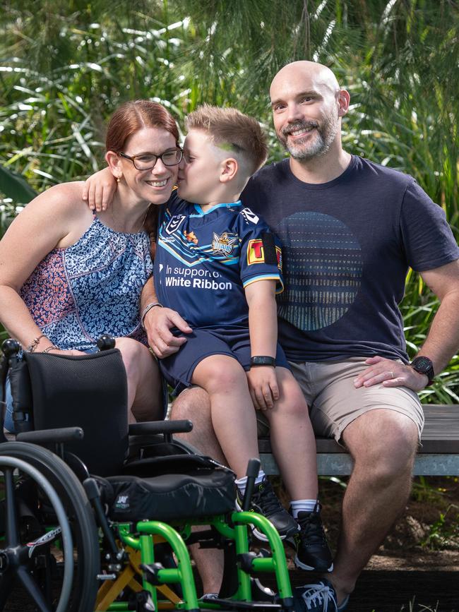 Sam, 6, with his mum Gillie and dad Justin. Picture: Brad Fleet