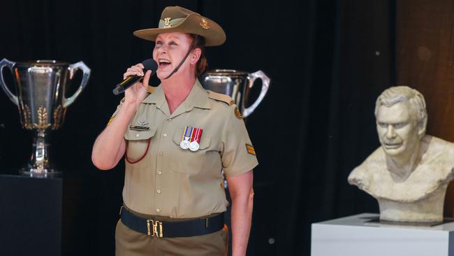 Corporal Fiona Wilkins sings the national anthem during the service. Picture: Asanka Ratnayake