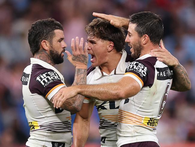 SYDNEY, AUSTRALIA - MARCH 06: AdamÃÂ Reynolds, Ben Hunt and Reece Walsh of the Broncos celebrate winning the round one NRL match between Sydney Roosters and Brisbane Broncos at Allianz Stadium on March 06, 2025, in Sydney, Australia. (Photo by Cameron Spencer/Getty Images)