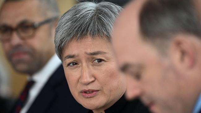 Penny Wong, centre, holds a press conference with Britain's Foreign Secretary James Cleverly, left, and Britain's Defence Secretary Ben Wallace, right, in Portsmouth. Picture: AFP