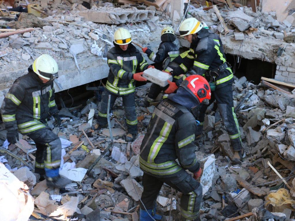 Rescuers conducting search operations and dismantling debris in Kharkiv. Picture: Ukrainian State Emergency Service / AFP