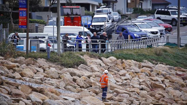 Onlookers surveyed the work being carried out at Cronulla beach on Friday. Picture: Sam Ruttyn